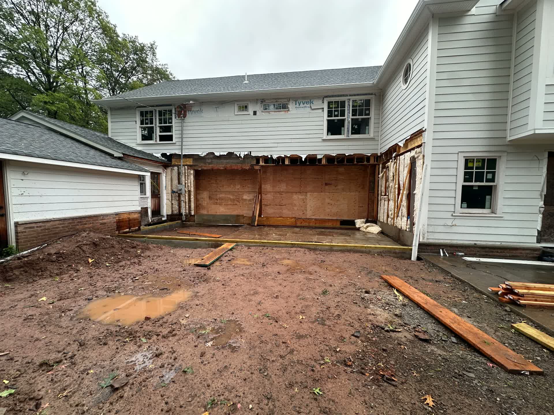A home addition opened up with new groundwork underway
